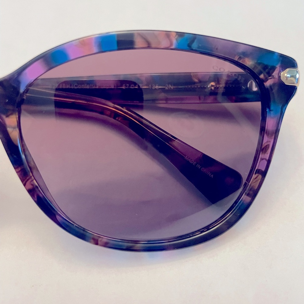 Brand new purple confetti tortoise Coach sunglasses with purple gradient lens.